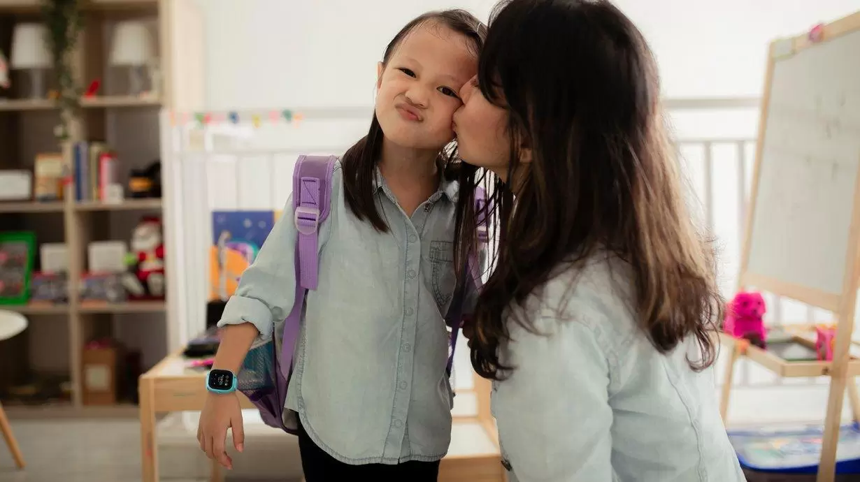 Mother Kissing Daughter Before School With Her New Gizmo Watch 3