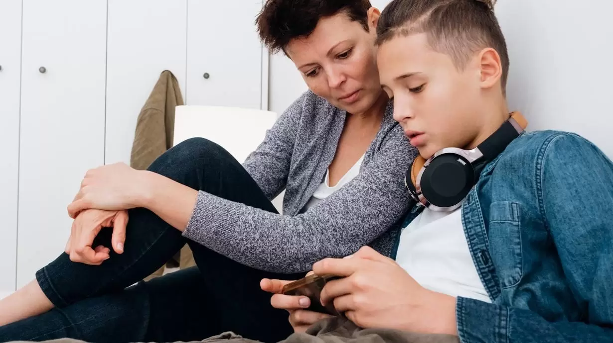 Mother And Son Discussing Threads App