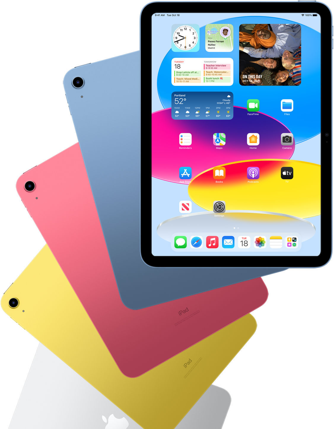 Vista frontal del iPad mostrando la pantalla de inicio con iPads azul, rosa, amarillo y color plata atrás.