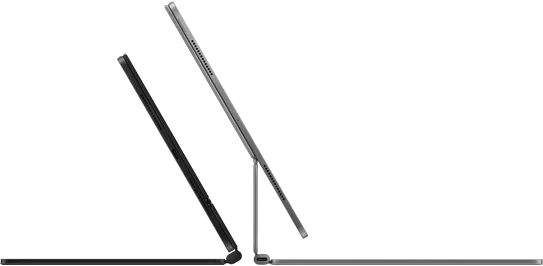 Dos Magic Keyboards con el iPad Pro fijado, uno detrás del otro, en acabados negro espacial y plata.