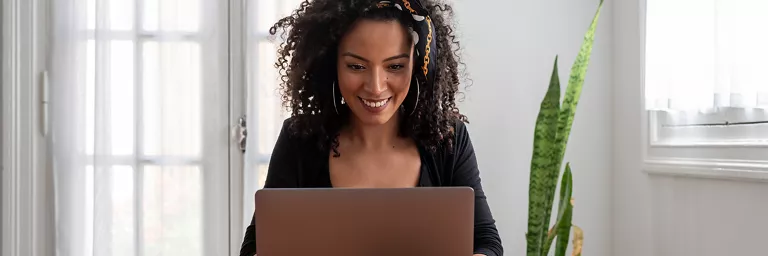 Woman using her laptop to work from home